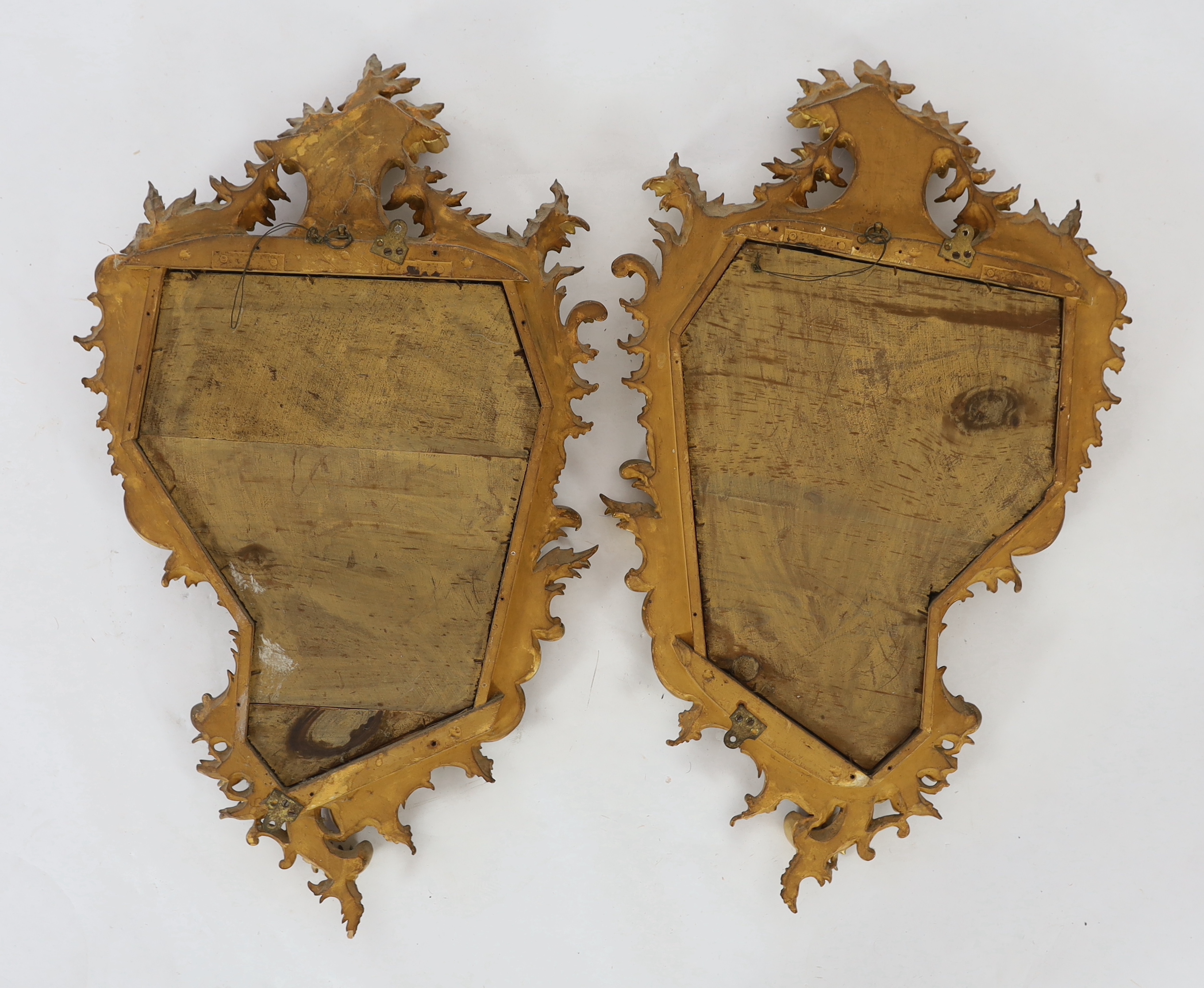 A pair of 19th century carved giltwood wall mirrors in the Rococo style, width 57cm, height 96cm
